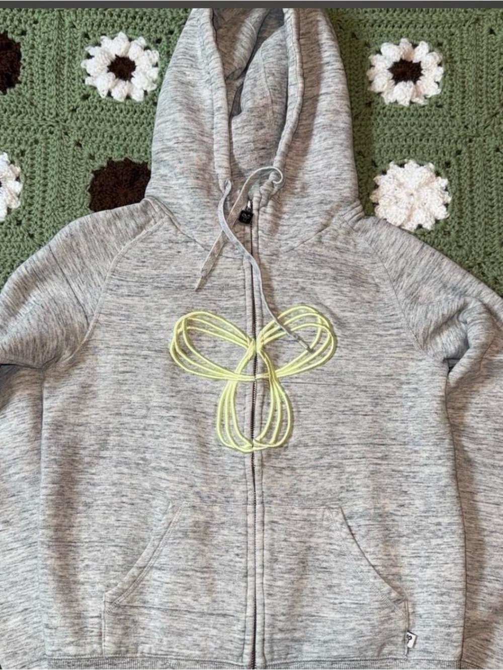 TNA Light Heather Gray Zip-Up Hoodie with Black Trim and yellow design